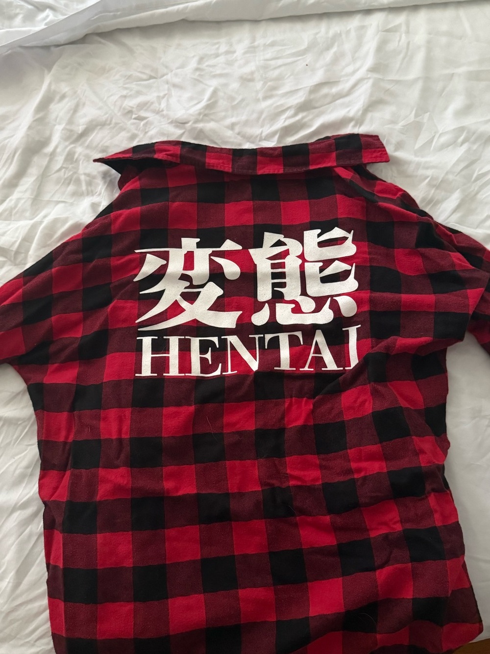 Red & Black Plaid Shirt with Bold White Graphic